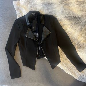 Mixed media blazer. Cut out back.